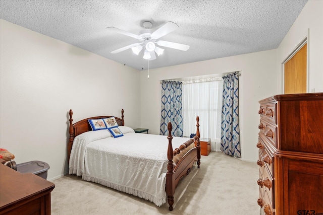 201 Terry St, White Oak, TX 75693 - bedroom with light carpet, a textured ceiling, a ceiling fan, and baseboards