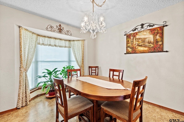 201 Terry St, White Oak, TX 75693 - dining area with a chandelier, baseboards, and a textured ceiling