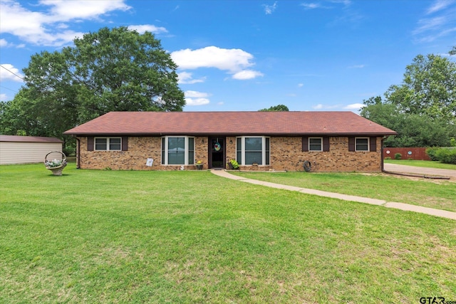 201 Terry St, White Oak, TX 75693 - ranch-style home featuring a front lawn and brick siding