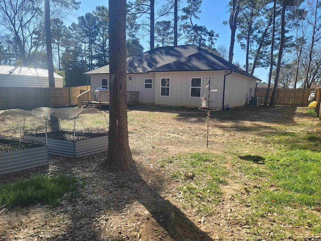 view of home's exterior featuring central AC unit and a yard