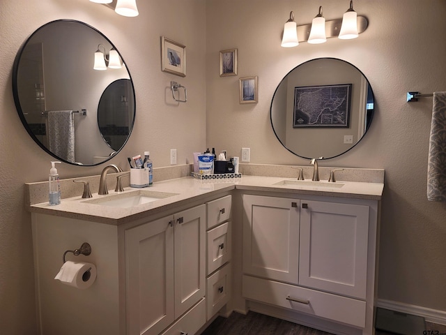 bathroom featuring wood finished floors and vanity