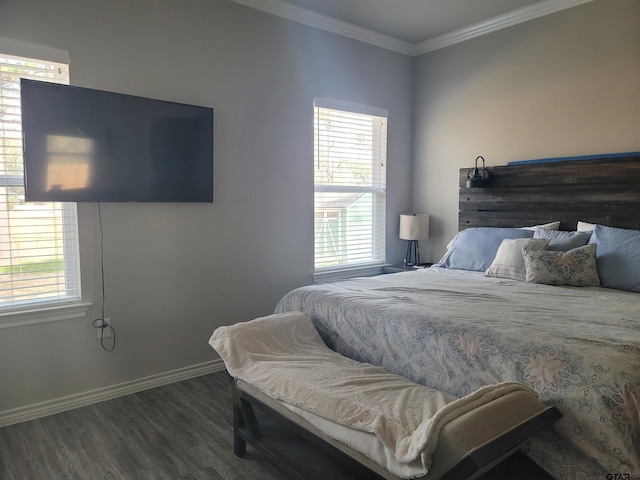 bedroom featuring multiple windows, baseboards, dark wood-style flooring, and crown molding