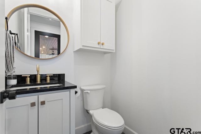 bathroom with vanity and toilet