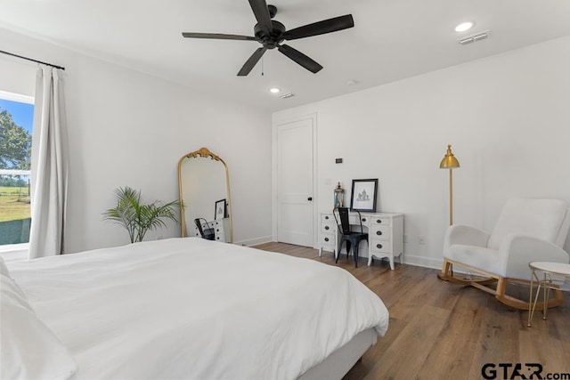 bedroom featuring wood-type flooring and ceiling fan