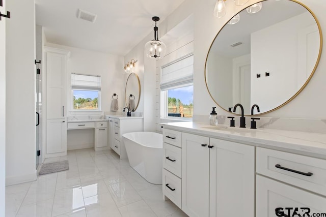 bathroom with vanity and a bathing tub