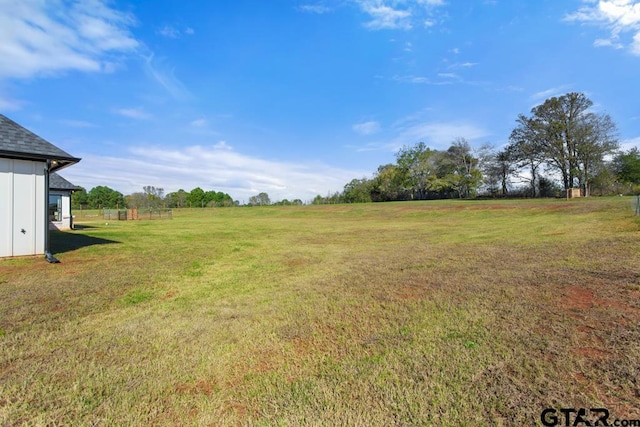 view of yard with a rural view