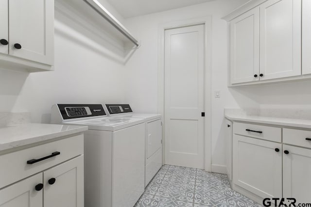 laundry area featuring cabinets and independent washer and dryer