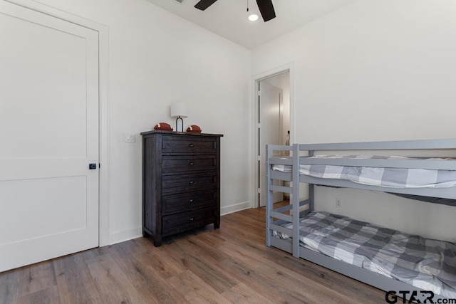 bedroom with ceiling fan and wood-type flooring