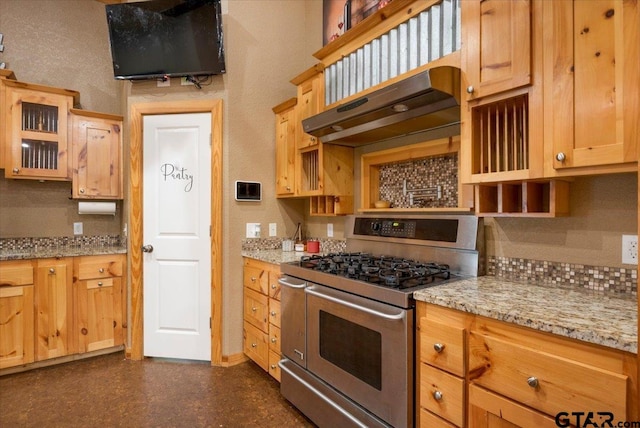 6841 Fm 778, Hawkins, TX 75765 - kitchen featuring glass insert cabinets, light stone countertops, double oven range, under cabinet range hood, and baseboards
