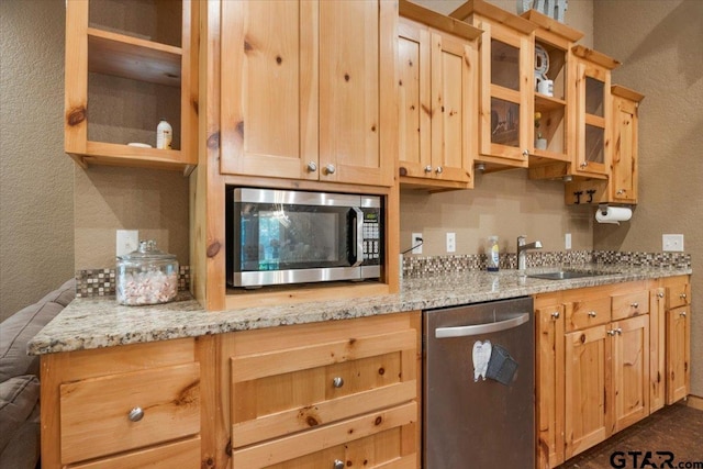 6841 Fm 778, Hawkins, TX 75765 - kitchen featuring a sink, a textured wall, appliances with stainless steel finishes, and light brown cabinets