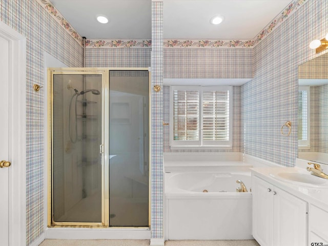 bathroom featuring shower with separate bathtub and vanity