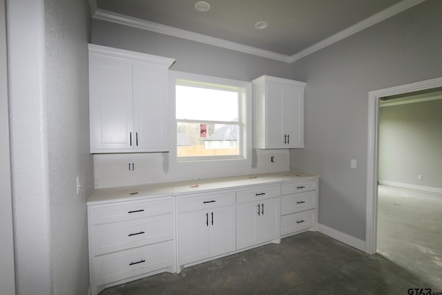 kitchen featuring white cabinetry and ornamental molding