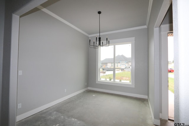 unfurnished dining area featuring concrete flooring, a chandelier, and crown molding