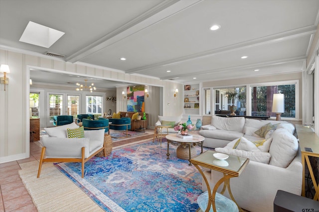 tiled living room featuring french doors, a skylight, ornamental molding, built in features, and beam ceiling