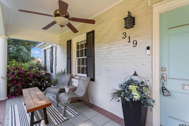 exterior space with ceiling fan and a porch