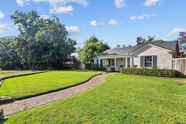 ranch-style home with a front lawn and a porch