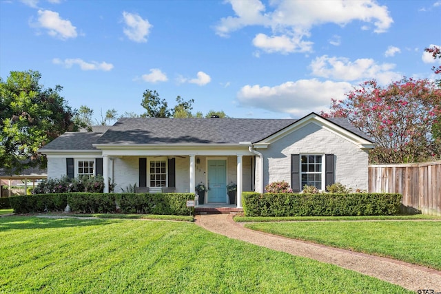 single story home featuring a porch and a front lawn