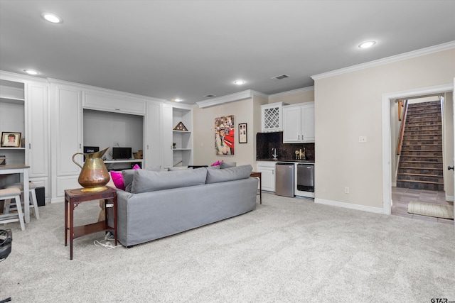 living room featuring light carpet, bar area, and ornamental molding