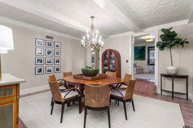 tiled dining room with beam ceiling, a textured ceiling, and a chandelier