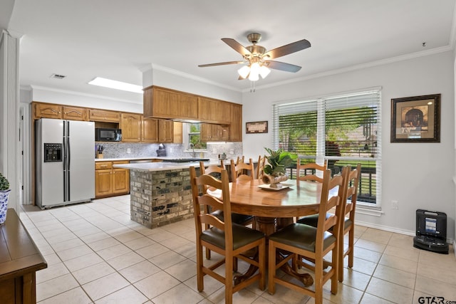 dining space featuring visible vents, crown molding, ceiling fan, and light tile patterned floors