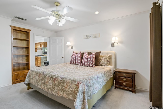 bedroom featuring light carpet, ornamental molding, visible vents, and baseboards