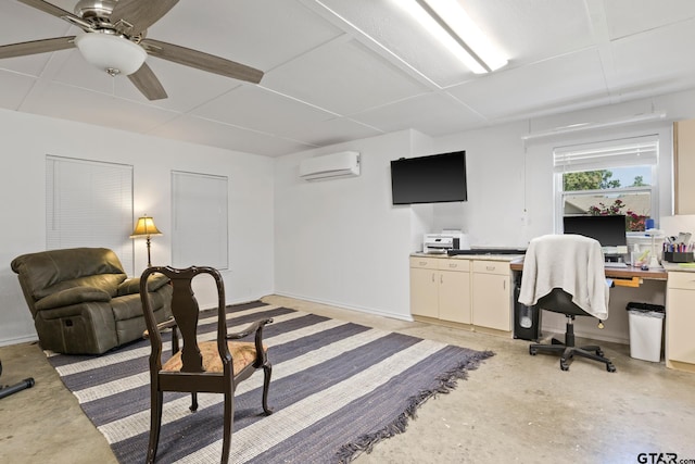 office with a wall mounted air conditioner, concrete floors, a ceiling fan, and baseboards