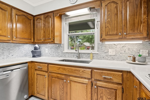 kitchen featuring dishwasher, brown cabinets, and a sink