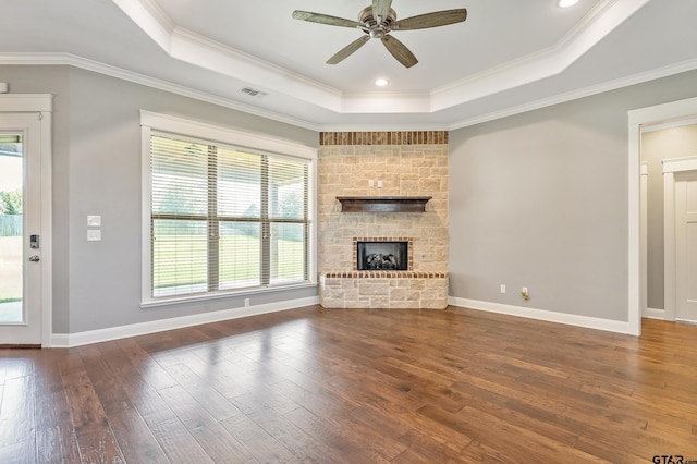 280 Bush Buck Way, Bullard, TX 75757 - unfurnished living room featuring a raised ceiling, healthy amount of natural light, hardwood / wood-style floors, a ceiling fan, and ornamental molding