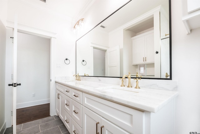 bathroom featuring tile patterned floors, vanity, and ornamental molding