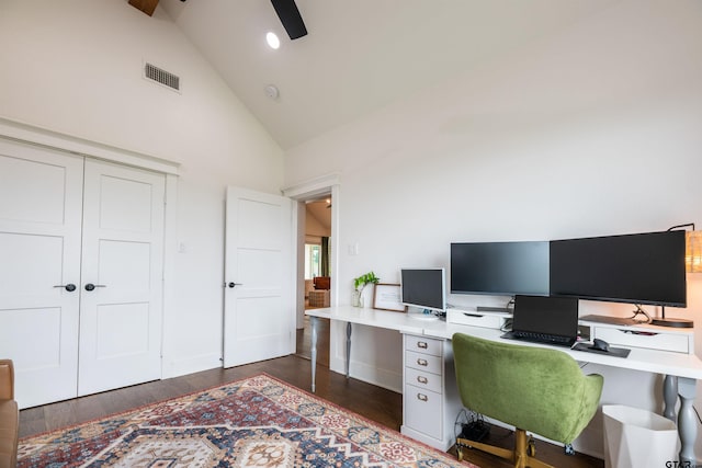 home office with dark hardwood / wood-style floors, high vaulted ceiling, and ceiling fan