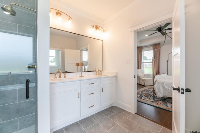 bathroom featuring a healthy amount of sunlight, ceiling fan, ornamental molding, and a shower with shower door