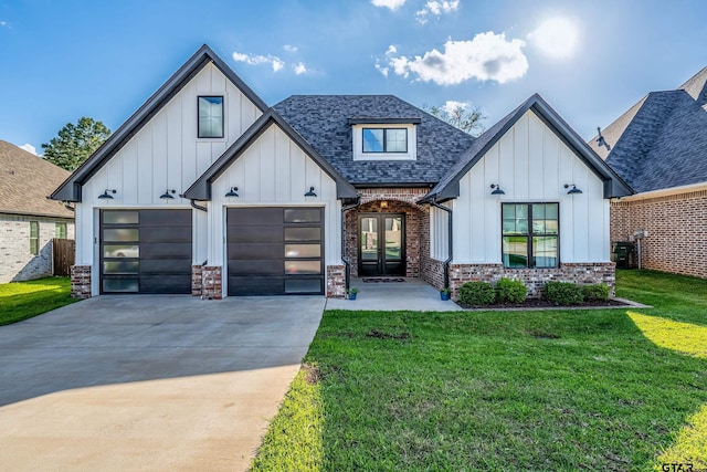 7584 Princedale, Tyler, TX 75703 - view of front of home with concrete driveway, board and batten siding, and a front yard