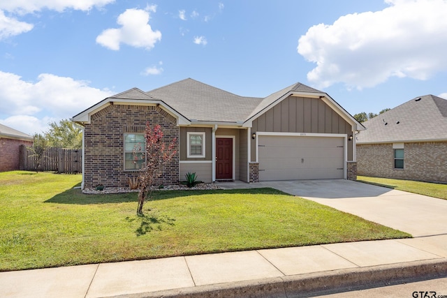 view of front of house with a garage and a front yard