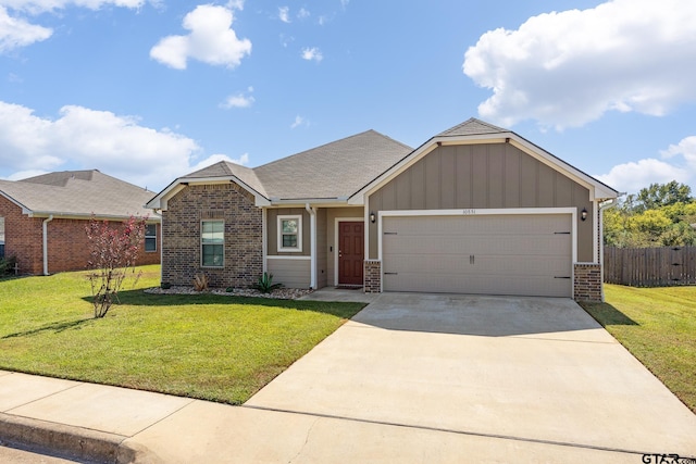 view of front of property with a front lawn and a garage