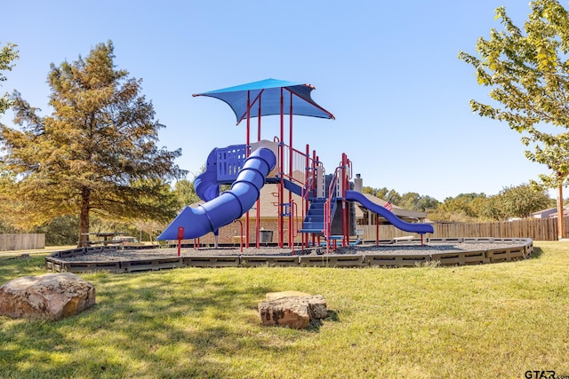 view of playground with a lawn