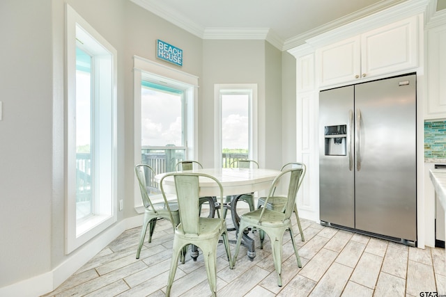 dining area featuring ornamental molding