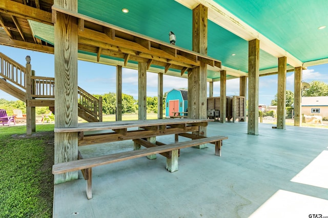 view of patio / terrace featuring a storage unit