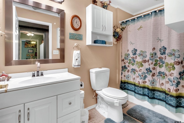 bathroom with vanity, shower / bath combo, ornamental molding, tile patterned floors, and toilet