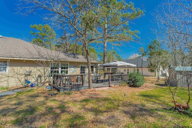 view of yard with a wooden deck