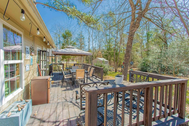 wooden deck with outdoor dining space