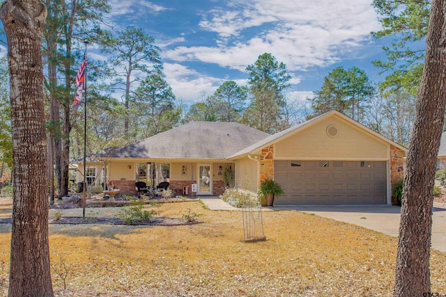 ranch-style home featuring an attached garage and driveway