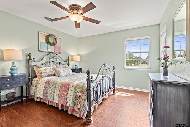 bedroom with hardwood / wood-style flooring and ceiling fan