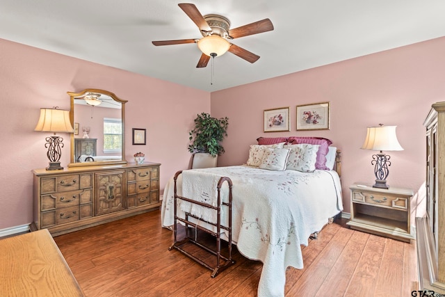 bedroom featuring hardwood / wood-style flooring and ceiling fan