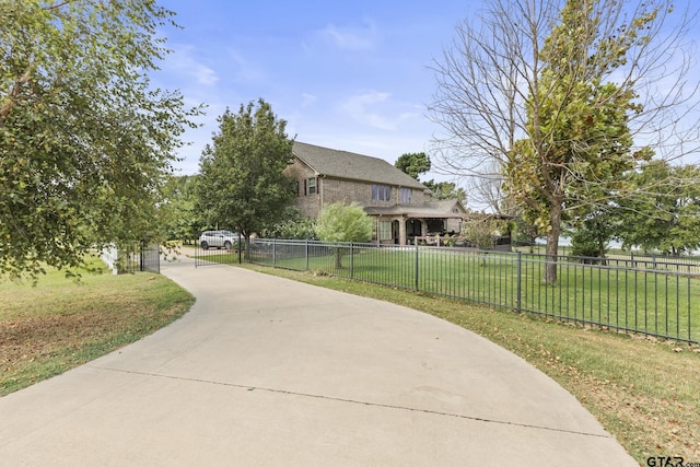 view of property's community with a yard