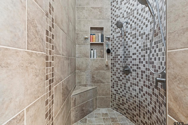 bathroom featuring tiled shower