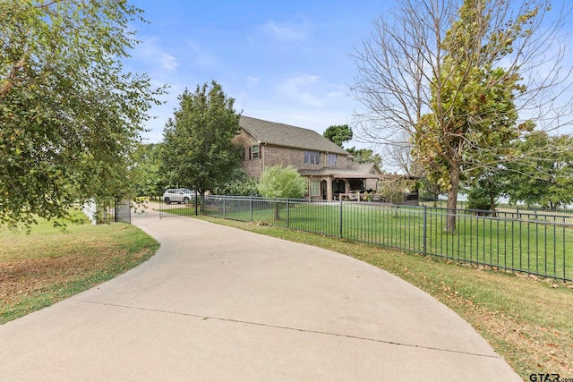 view of property's community featuring a lawn