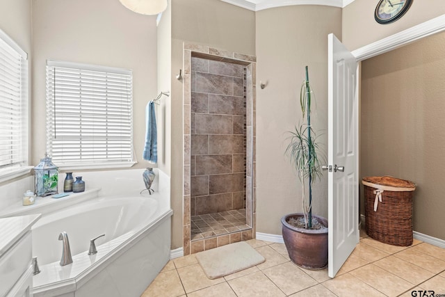 bathroom featuring plus walk in shower and tile patterned floors