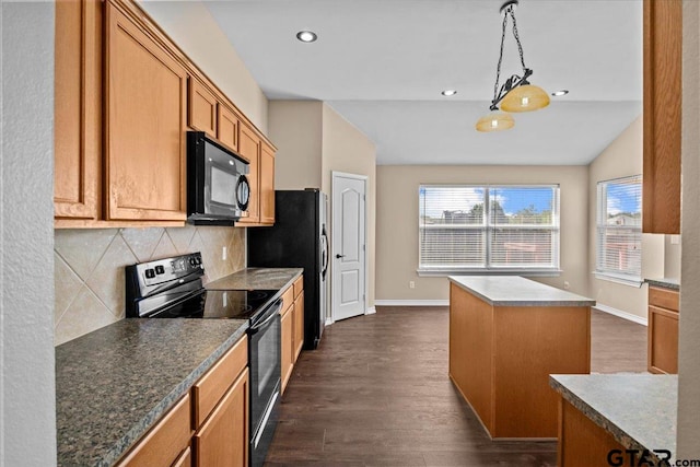 kitchen with lofted ceiling, black appliances, dark hardwood / wood-style floors, tasteful backsplash, and a kitchen island