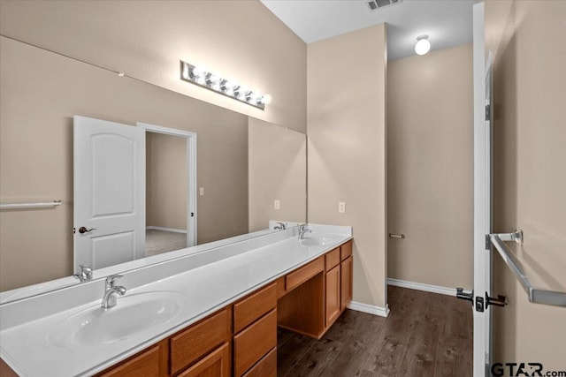 bathroom featuring wood-type flooring and vanity