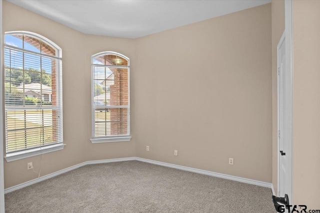 empty room with light colored carpet